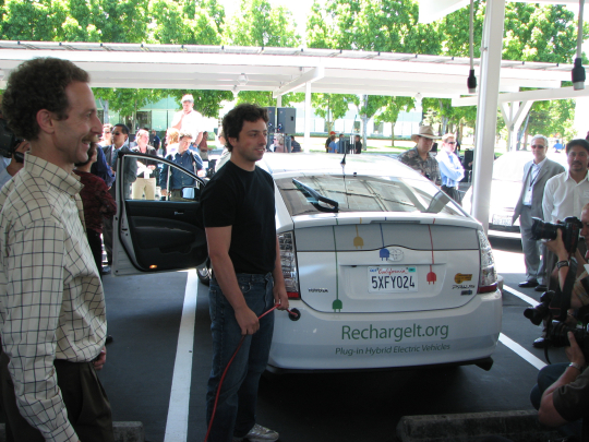 Google's Sergey Brin plugs in the car to start the V2G demonstration